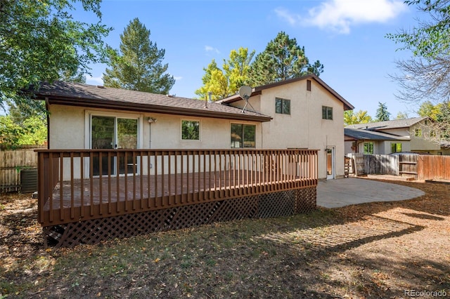 rear view of property with a patio area and a deck