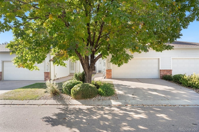 obstructed view of property featuring a garage