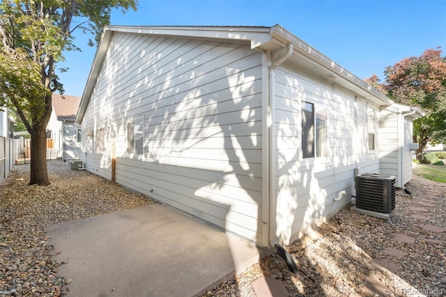 view of property exterior featuring a patio and central AC unit