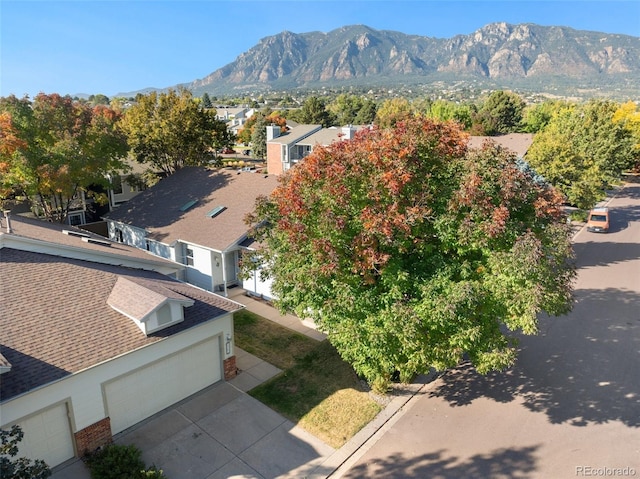 birds eye view of property with a mountain view