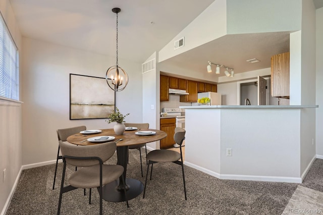 5705 N Genoa Way Unit 308, Aurora, CO 80019 - dining room featuring carpet flooring, a chandelier, and baseboards