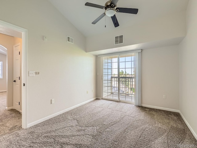 5705 N Genoa Way Unit 308, Aurora, CO 80019 - empty room featuring carpet flooring, arched walkways, ceiling fan, baseboards, and high vaulted ceiling