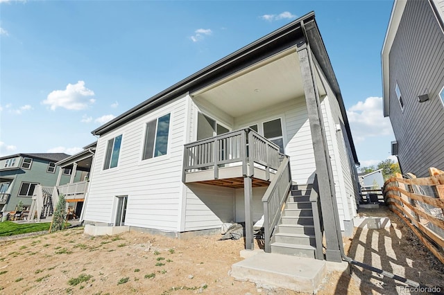 5930 S Platte Canyon Dr, Littleton, CO 80123 - rear view of property with stairway and a deck