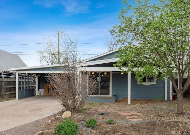 view of front of property featuring a carport