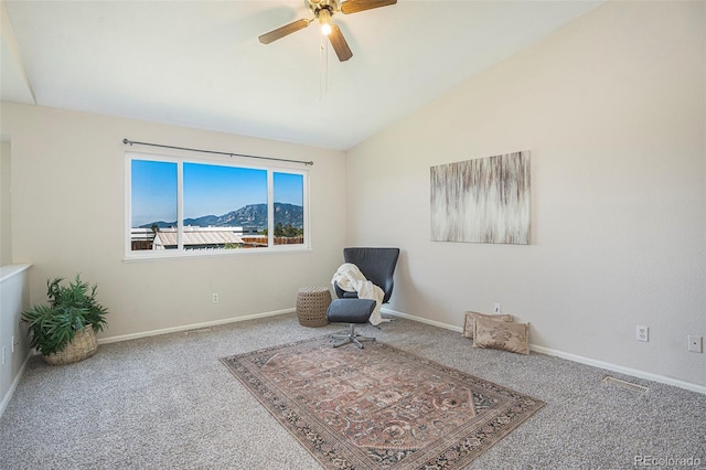 4585 Jet Wing Cir, Colorado Springs, CO 80916 - living area featuring carpet floors, a ceiling fan, vaulted ceiling, baseboards, and a mountain view
