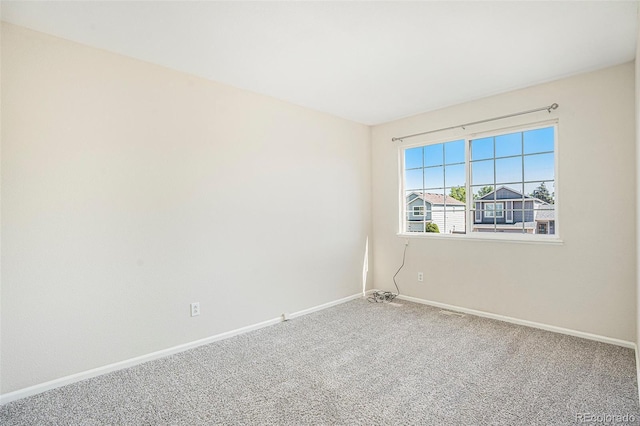 4585 Jet Wing Cir, Colorado Springs, CO 80916 - spare room featuring carpet floors and baseboards