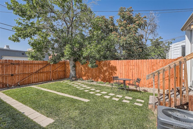 view of yard featuring central air condition unit