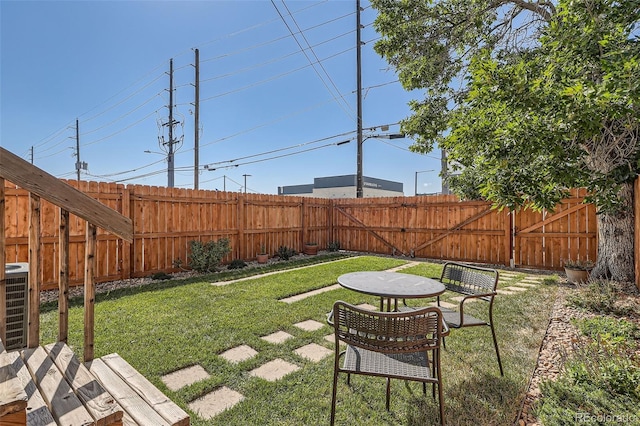 view of yard featuring central AC