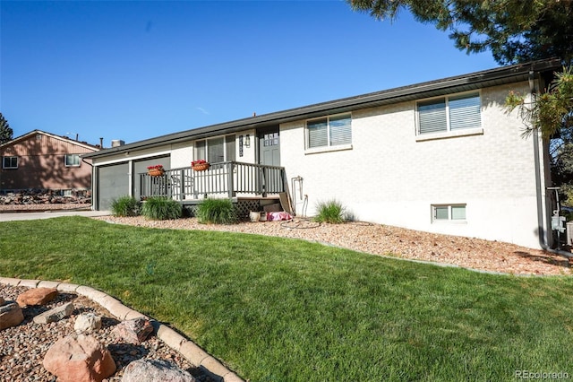 7100 Saulsbury St, Arvada, CO 80003 - single story home with a front yard, an attached garage, brick siding, and concrete driveway