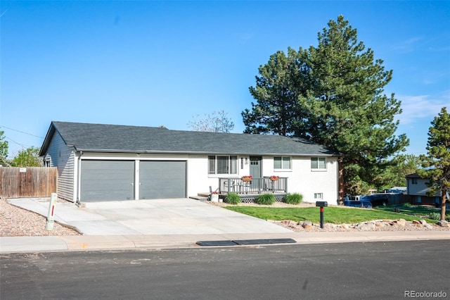 7100 Saulsbury St, Arvada, CO 80003 - ranch-style house with a garage and concrete driveway