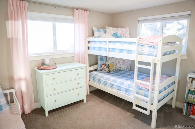 7100 Saulsbury St, Arvada, CO 80003 - carpeted bedroom featuring multiple windows