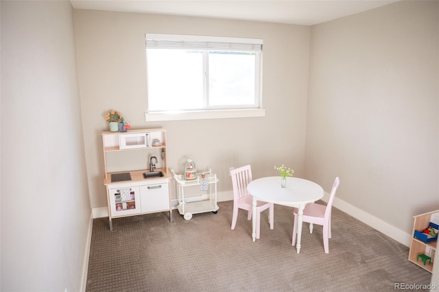 7100 Saulsbury St, Arvada, CO 80003 - playroom with carpet flooring and baseboards