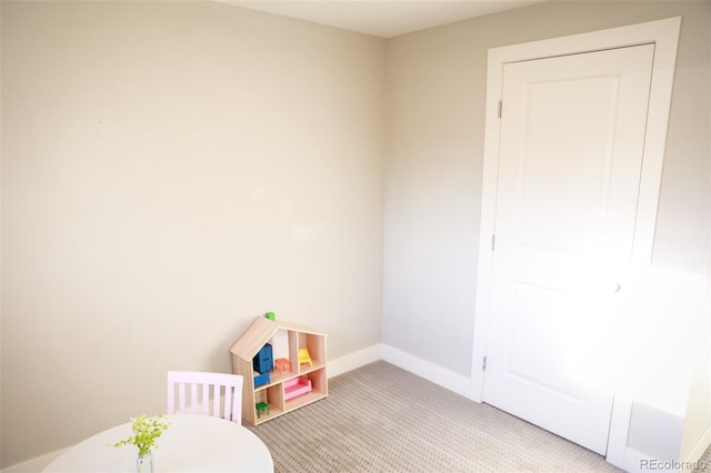 7100 Saulsbury St, Arvada, CO 80003 - rec room with baseboards and light colored carpet