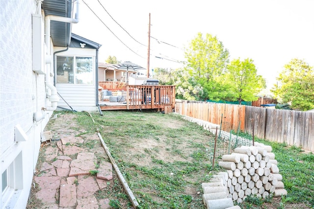 7100 Saulsbury St, Arvada, CO 80003 - fenced backyard with a deck