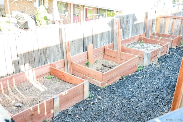 7100 Saulsbury St, Arvada, CO 80003 - deck featuring a vegetable garden