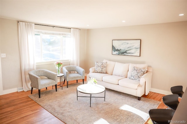 7100 Saulsbury St, Arvada, CO 80003 - living area featuring light wood-style floors, baseboards, and recessed lighting
