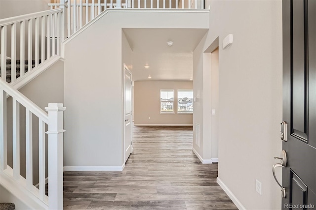 foyer entrance featuring hardwood / wood-style flooring