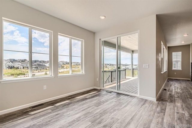 spare room featuring hardwood / wood-style floors