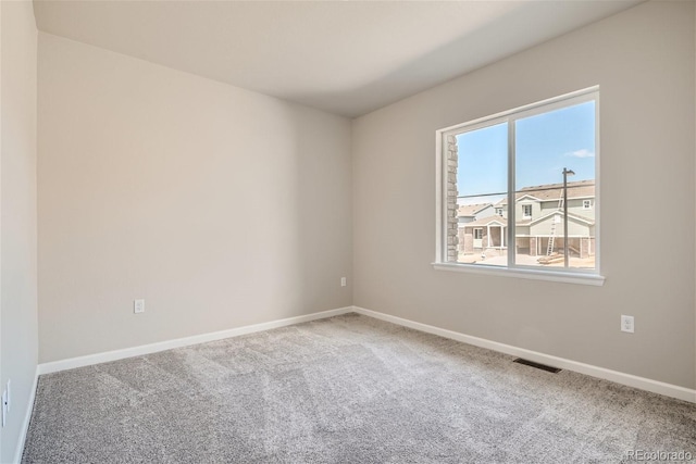 view of carpeted spare room