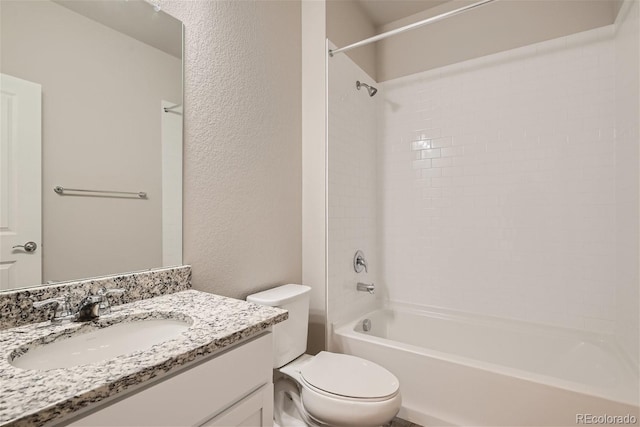 full bathroom with vanity, toilet, and tiled shower / bath