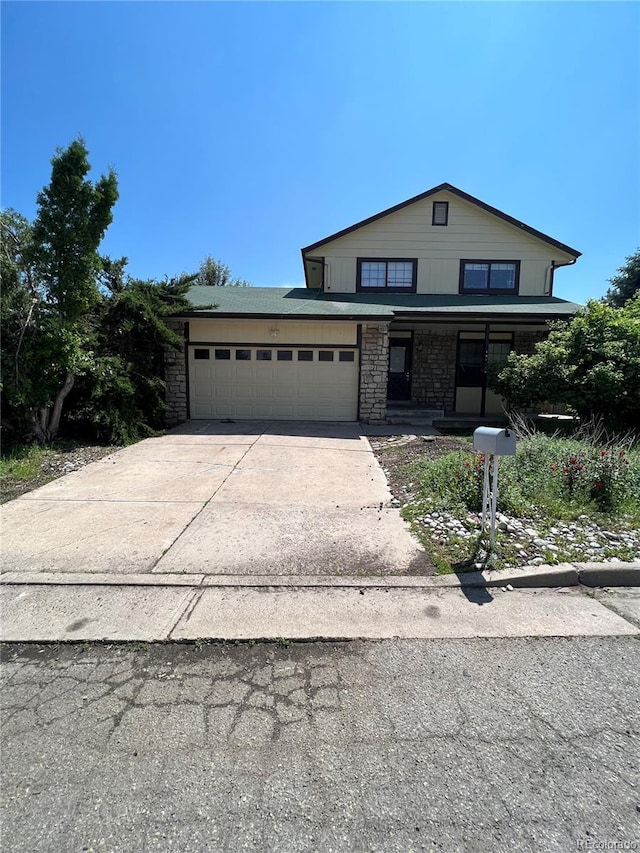 view of front of house featuring a porch and a garage