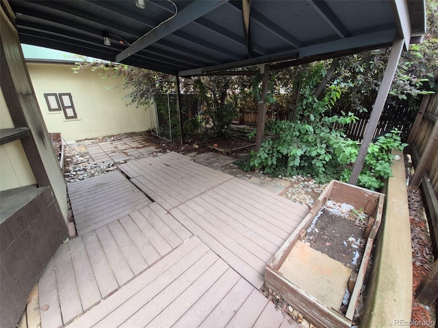 14190 E Gunnison Pl, Aurora, CO 80012 - wooden terrace featuring a fenced backyard and a garden