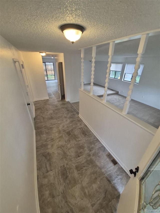 14190 E Gunnison Pl, Aurora, CO 80012 - hallway with a textured ceiling