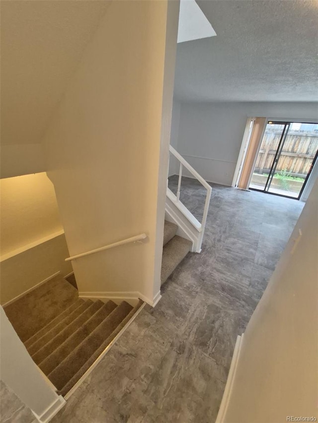 14190 E Gunnison Pl, Aurora, CO 80012 - staircase with a textured ceiling