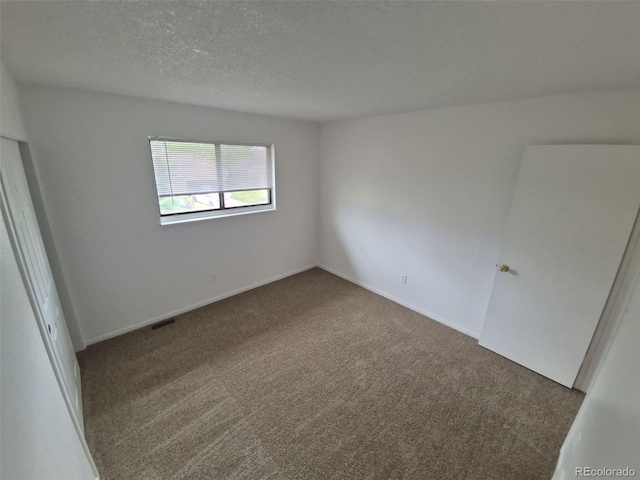 14190 E Gunnison Pl, Aurora, CO 80012 - carpeted empty room featuring a textured ceiling and baseboards