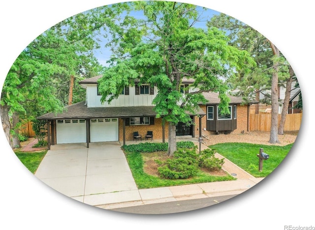 7168 S Lafayette Way, Centennial, CO 80122 - split level home featuring an attached garage, driveway, board and batten siding, a porch, and a shingled roof