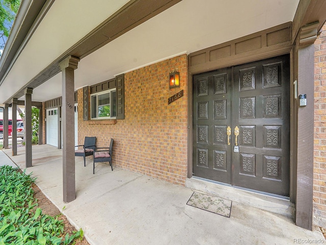 7168 S Lafayette Way, Centennial, CO 80122 - entrance to property featuring covered porch and brick siding
