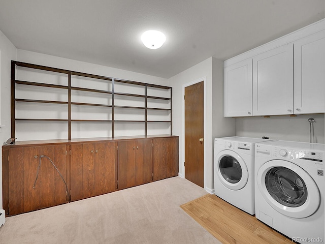 7168 S Lafayette Way, Centennial, CO 80122 - laundry area featuring cabinet space, washer and clothes dryer, and light colored carpet