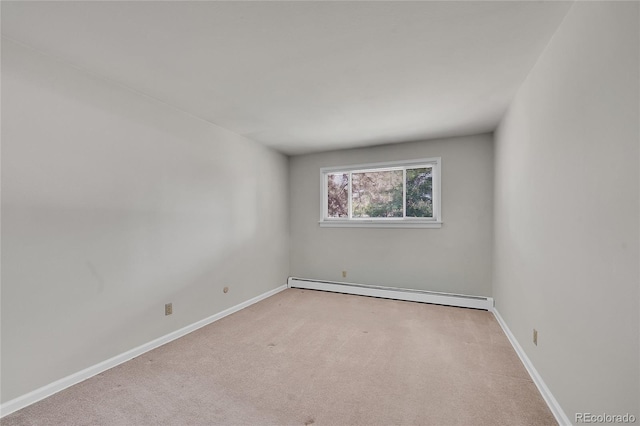7168 S Lafayette Way, Centennial, CO 80122 - carpeted empty room with a baseboard heating unit and baseboards