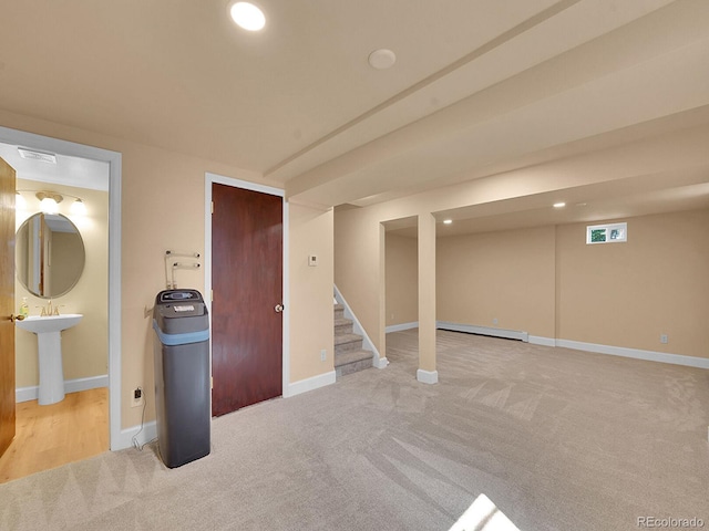 7168 S Lafayette Way, Centennial, CO 80122 - finished basement with a baseboard radiator, carpet, a water softener, stairs, and recessed lighting