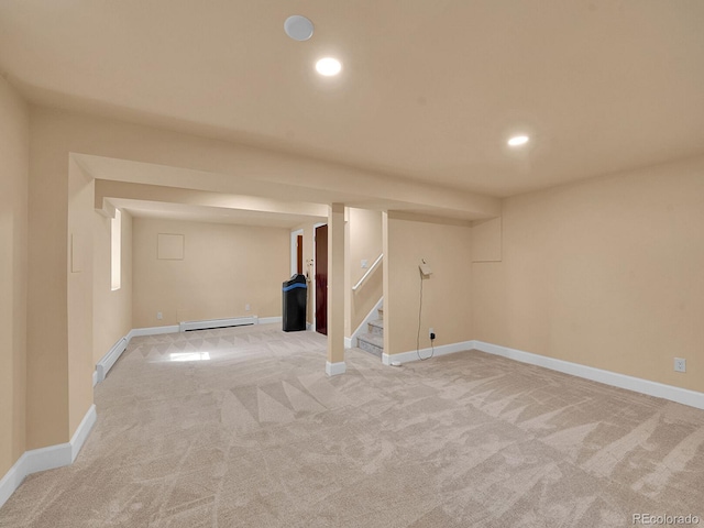 7168 S Lafayette Way, Centennial, CO 80122 - finished below grade area with a baseboard heating unit, light colored carpet, recessed lighting, and stairway