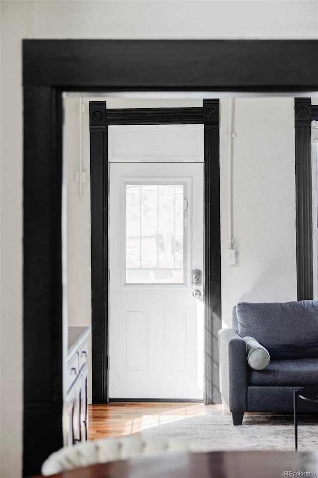 doorway to outside with wood finished floors