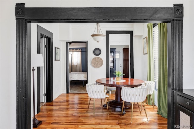 dining area featuring light wood-style floors