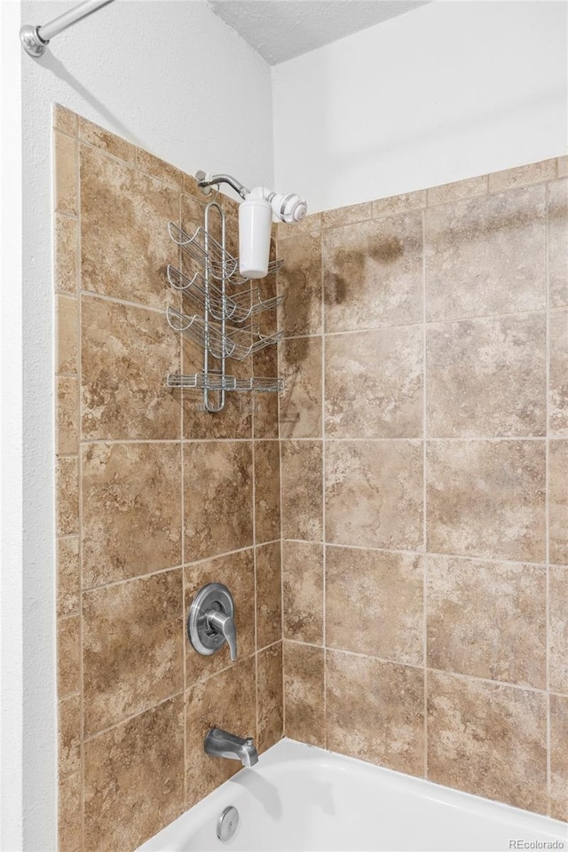 bathroom featuring washtub / shower combination