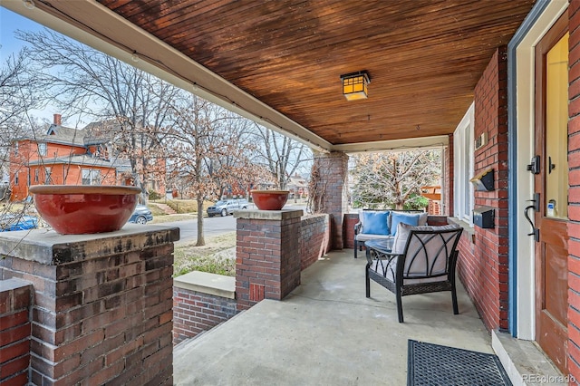 view of patio featuring a porch