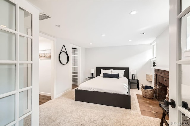 bedroom with visible vents and recessed lighting