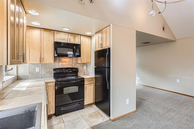 kitchen featuring recessed lighting, light countertops, visible vents, light brown cabinets, and black appliances
