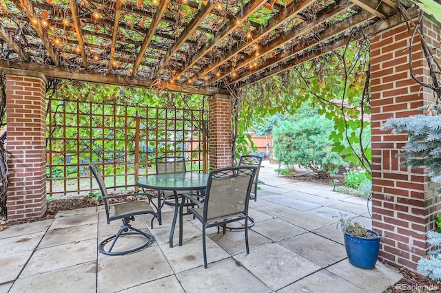 view of patio / terrace with a pergola and outdoor dining area