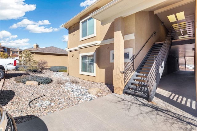 1965 Montura Vw Unit 204, Colorado Springs, CO 80919 - exterior space with stucco siding and stairway