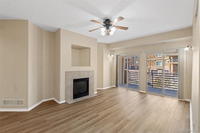 1965 Montura Vw Unit 204, Colorado Springs, CO 80919 - unfurnished living room with ceiling fan, visible vents, baseboards, and wood finished floors