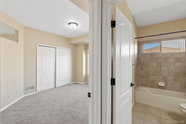 1965 Montura Vw Unit 204, Colorado Springs, CO 80919 - bathroom featuring toilet, visible vents, baseboards, and tub / shower combination