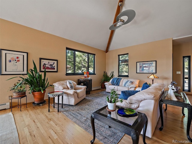 31518 Niakwa Rd, Evergreen, CO 80439 - living room featuring wood finished floors and baseboard heating
