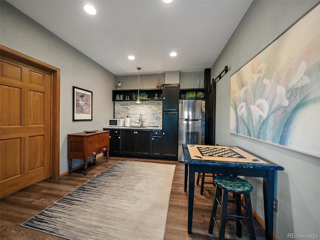 31518 Niakwa Rd, Evergreen, CO 80439 - indoor wet bar with freestanding refrigerator, white microwave, dark wood-style floors, backsplash, and recessed lighting