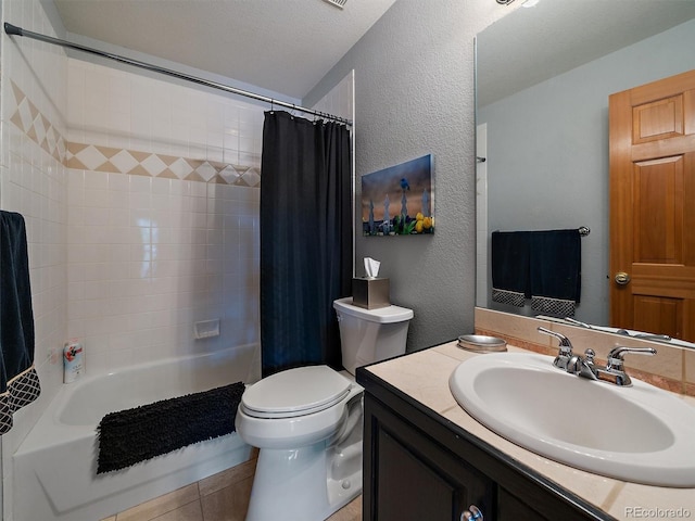 31518 Niakwa Rd, Evergreen, CO 80439 - full bathroom featuring vanity, shower / bath combo with shower curtain, toilet, a textured wall, and tile patterned flooring