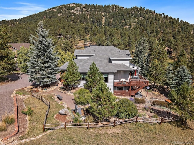 31518 Niakwa Rd, Evergreen, CO 80439 - aerial view of property and surrounding area featuring a heavily wooded area