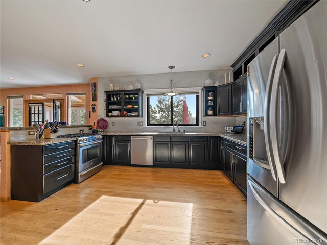 31518 Niakwa Rd, Evergreen, CO 80439 - kitchen with appliances with stainless steel finishes, a sink, healthy amount of natural light, backsplash, and recessed lighting